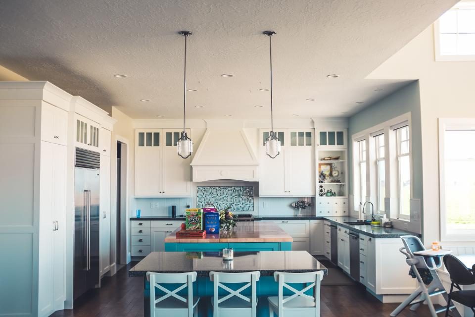 A bright open-plan kitchen with an island bench